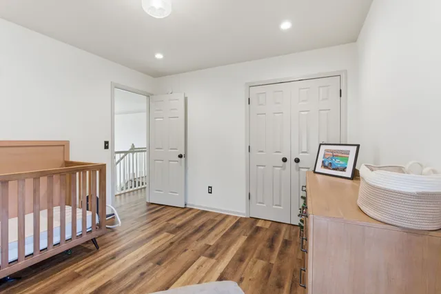 a view of hallway with wooden floor