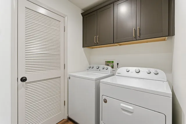 a view of storage and utility room with washer and dryer