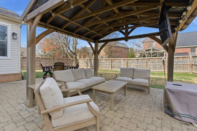 a outdoor space with patio couches and a potted plant