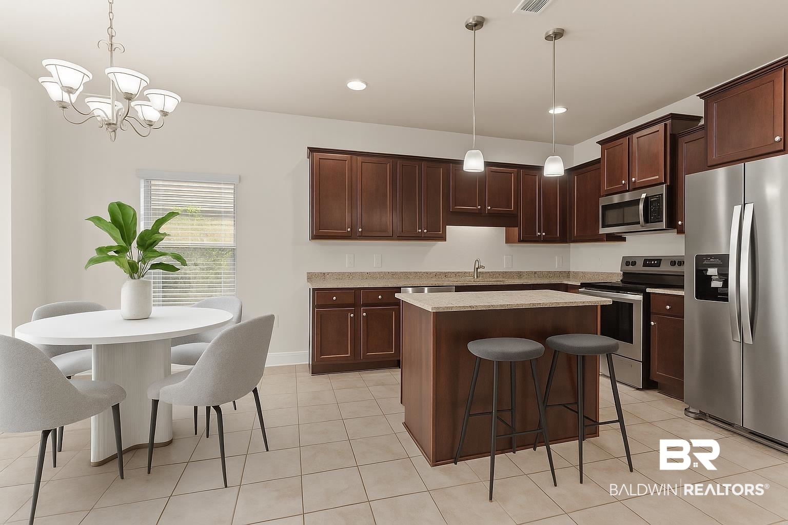 1464 Surrey Loop Foley, AL 36535 - Photo 13 of 24 Kitchen with stainless steel appliances, a kitchen bar, pendant lighting, a center island, and light tile patterned floors