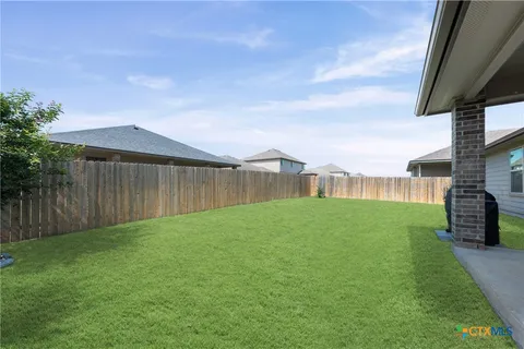 a view of a backyard with a garden