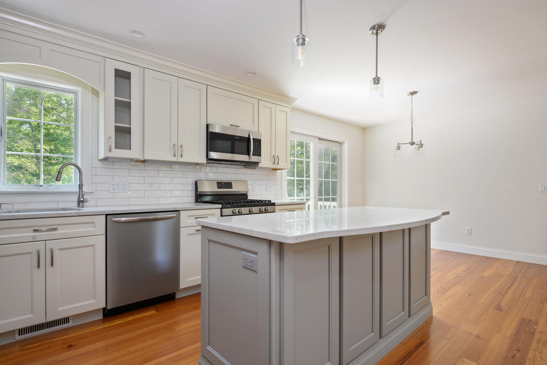 18 Asa Meiggs Road Sandwich, MA 02563 - Photo 8 of 30 a kitchen with kitchen island a sink a stove a microwave and wooden floor