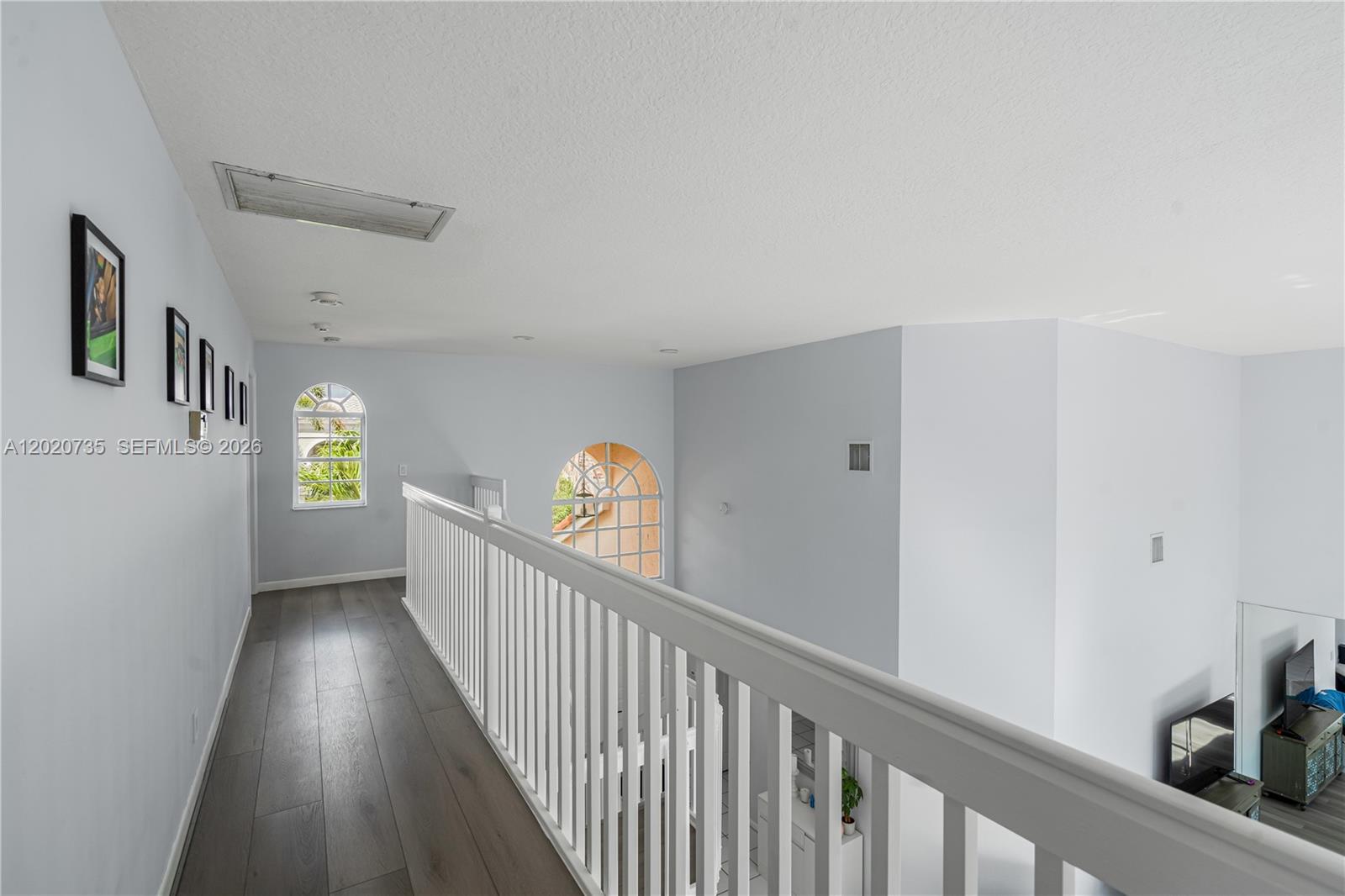 17244 Balboa Point Way Boca Raton, FL 33487 - Photo 55 of 66 a view of hallway with wooden floor