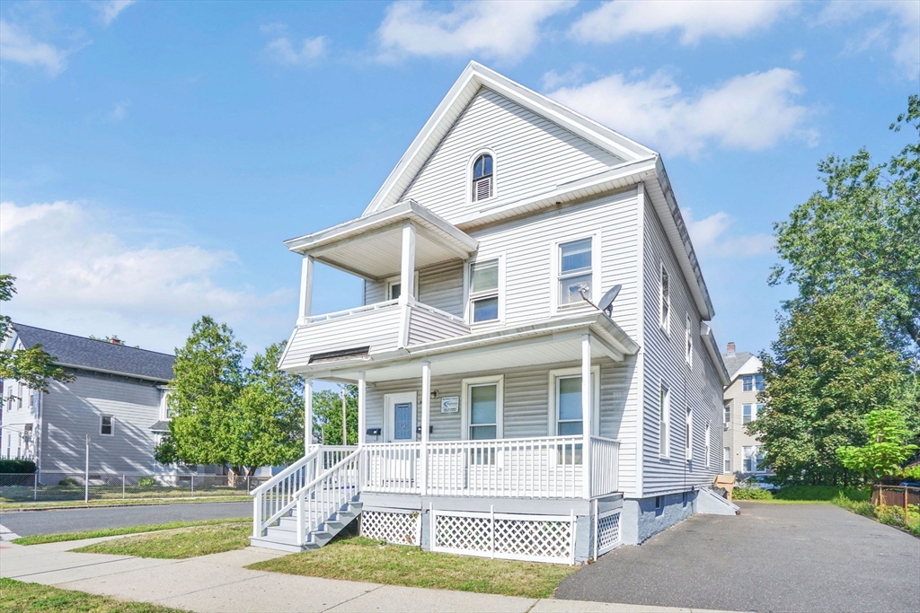 96 Bay Street Springfield, MA 01109 - Photo 2 of 25 a front view of a house with a yard