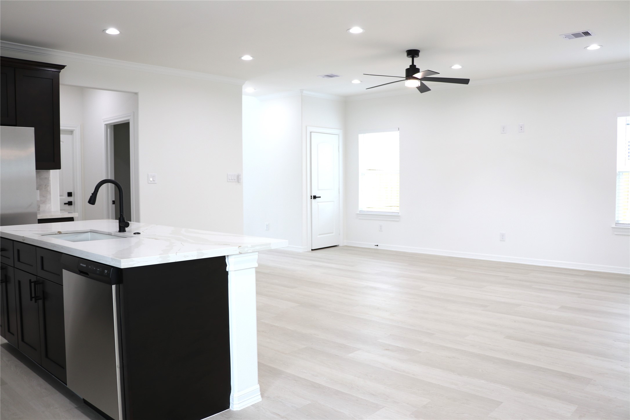 16602 Bonnie Sean Drive Spring, TX 77379 - Photo 4 of 14 a kitchen with a sink cabinets and wooden floor