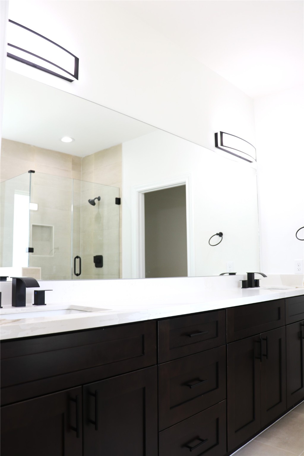16602 Bonnie Sean Drive Spring, TX 77379 - Photo 7 of 14 a bathroom with a double vanity sink and mirror