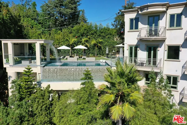 an aerial view of a building with a garden
