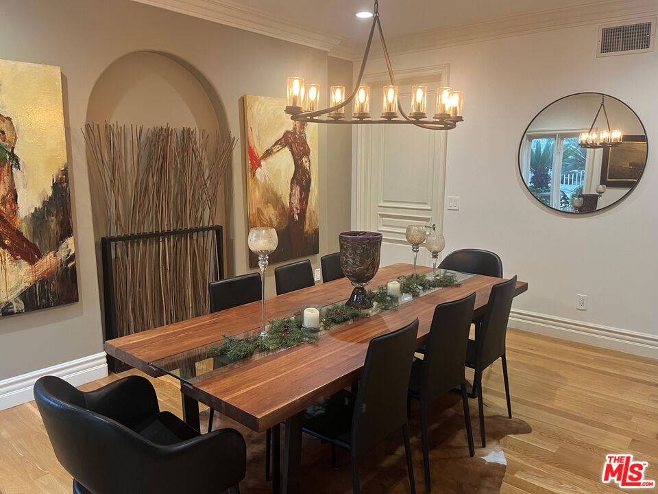 1861 Bel Air Road Los Angeles, CA 90077 - Photo 14 of 44 a view of a dining room with furniture and wooden floor