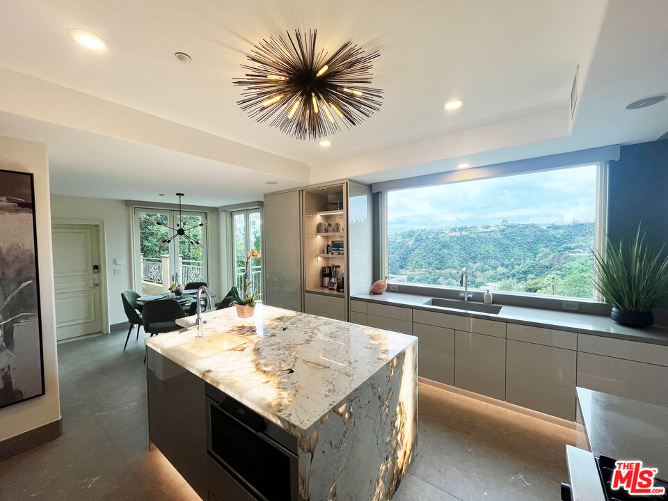 1861 Bel Air Road Los Angeles, CA 90077 - Photo 16 of 44 a kitchen with sink and view of living room