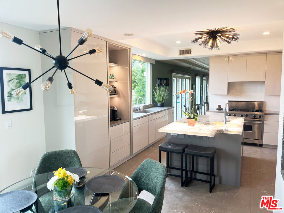 1861 Bel Air Road Los Angeles, CA 90077 - Photo 18 of 44 a dining room with furniture and window