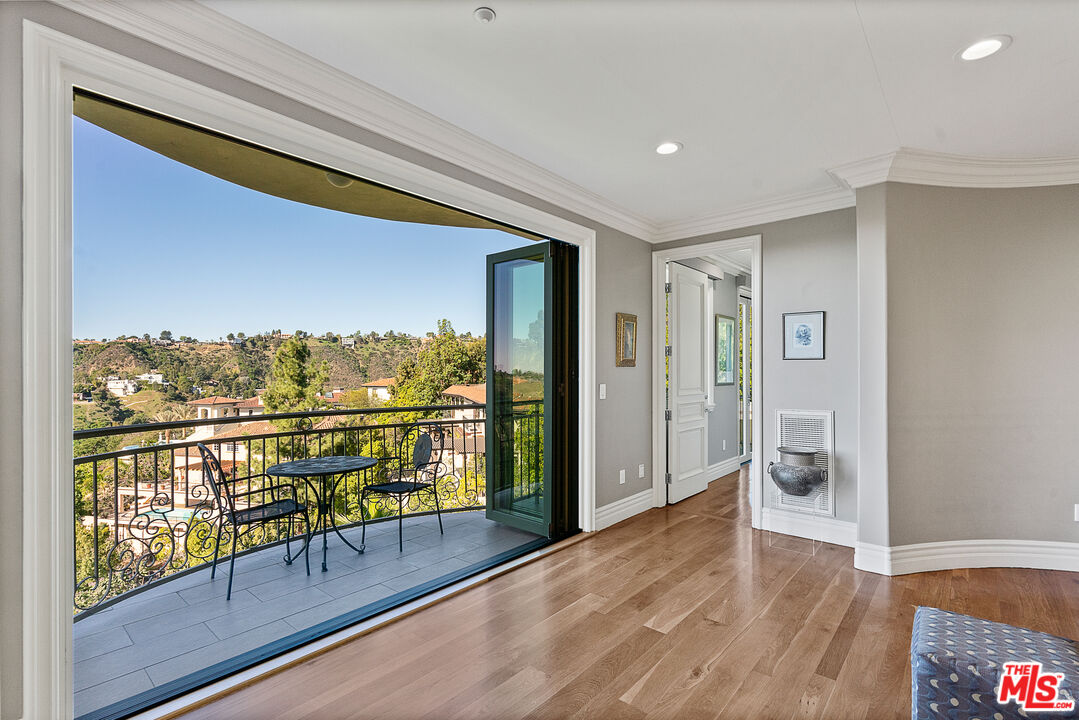 1861 Bel Air Road Los Angeles, CA 90077 - Photo 22 of 44 a view of balcony with wooden floor