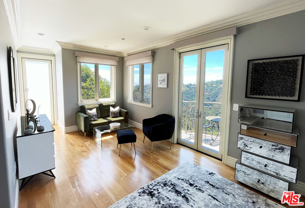 1861 Bel Air Road Los Angeles, CA 90077 - Photo 30 of 44 a living room with furniture and a flat screen tv