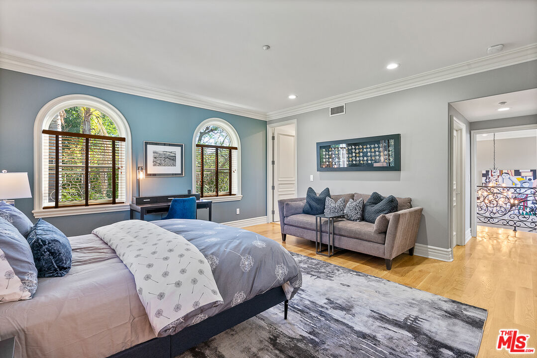 1861 Bel Air Road Los Angeles, CA 90077 - Photo 34 of 44 a spacious bedroom with a bed and a couch