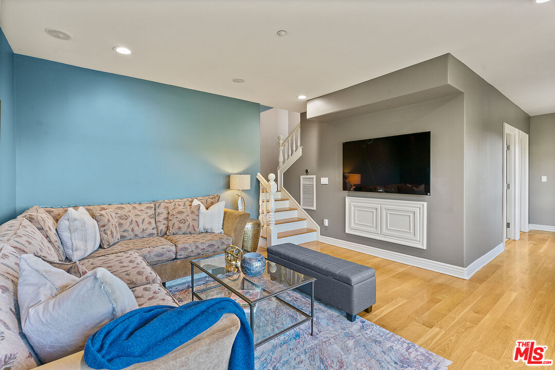 1861 Bel Air Road Los Angeles, CA 90077 - Photo 41 of 44 a living room with furniture and a flat screen tv