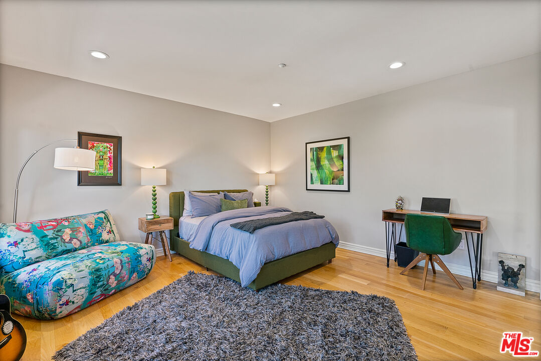 1861 Bel Air Road Los Angeles, CA 90077 - Photo 42 of 44 a bedroom with a bed and a couch