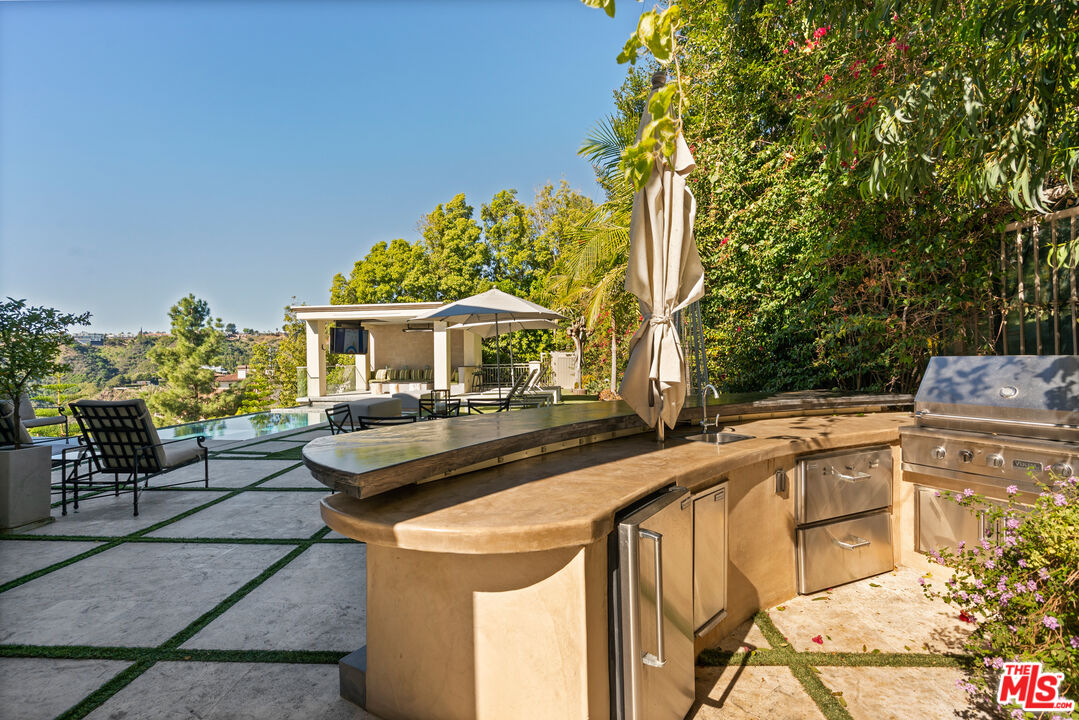 1861 Bel Air Road Los Angeles, CA 90077 - Photo 6 of 44 a front view of a house with sitting area