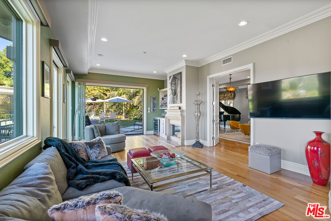 1861 Bel Air Road Los Angeles, CA 90077 - Photo 8 of 44 a living room with furniture and a flat screen tv