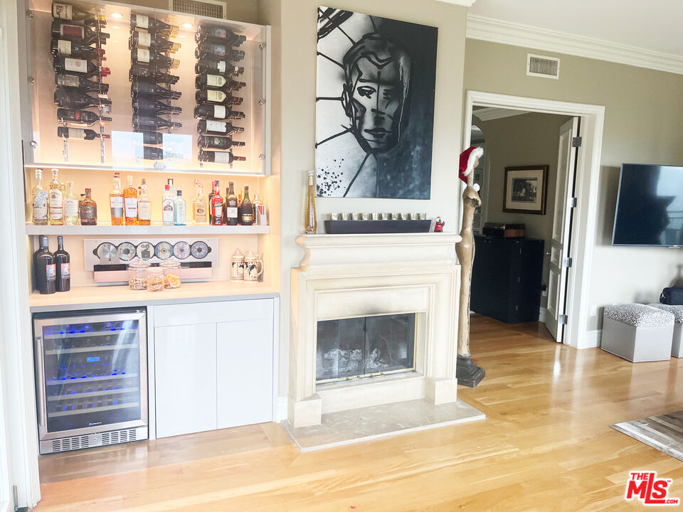 1861 Bel Air Road Los Angeles, CA 90077 - Photo 9 of 44 a hallway with a stove and a kitchen view