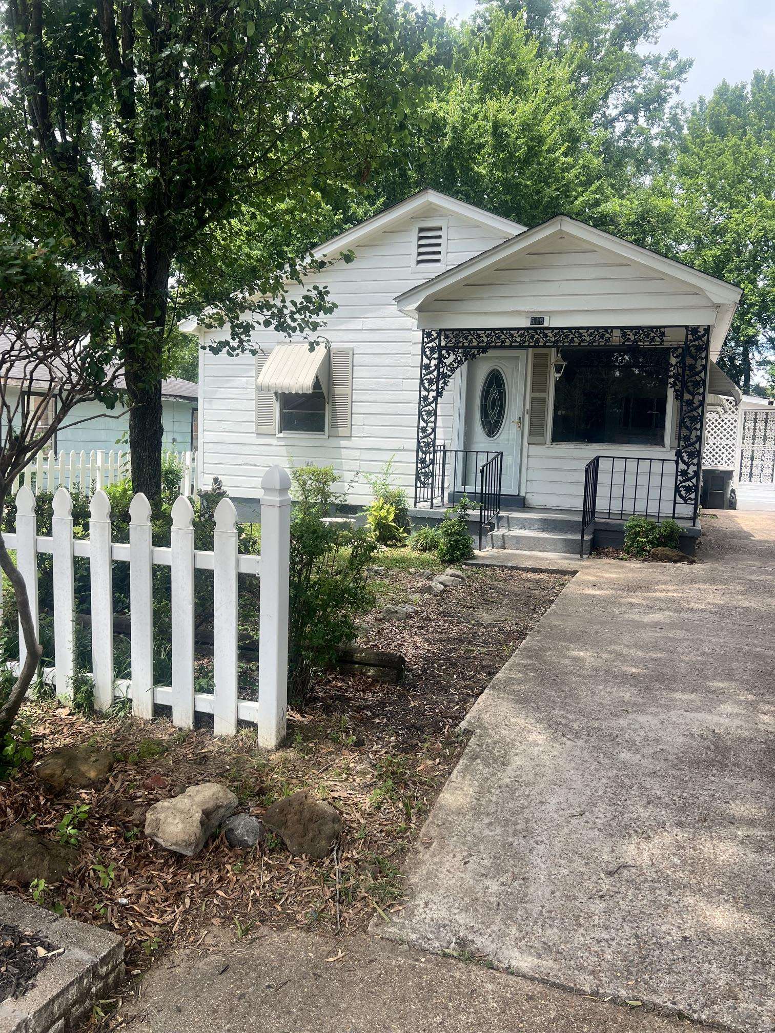 518 Harris Street Collierville, TN 38017 - Photo 13 of 13 White exterior with a covered front porch featuring decorative ironwork