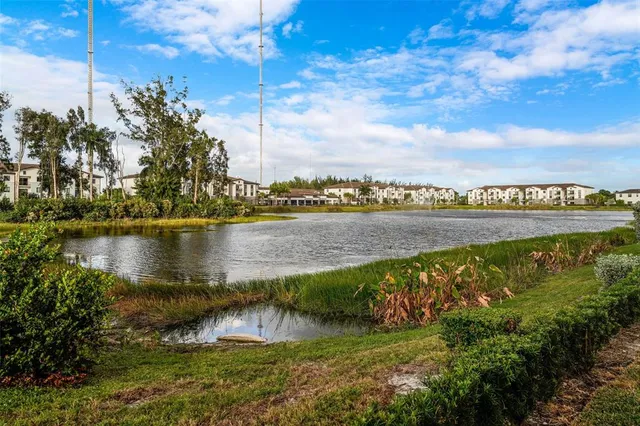 a view of a lake with houses in the back