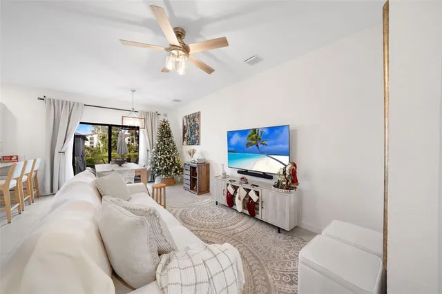 a bed room with furniture and a flat screen tv