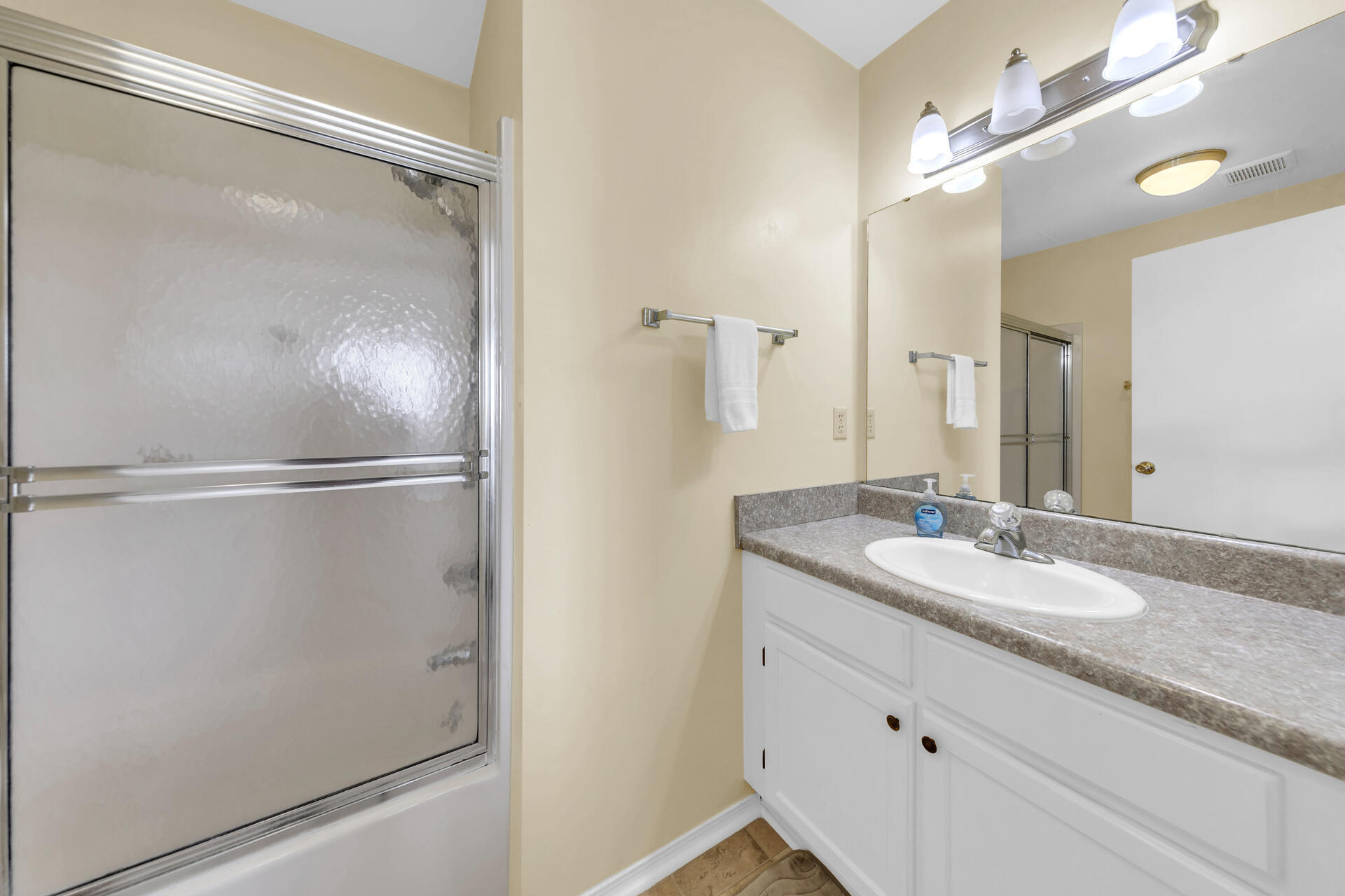 60 Sandprints Drive, Unit C4 Miramar Beach, FL 32550 - Photo 11 of 28 a bathroom with a granite countertop shower sink vanity and mirror