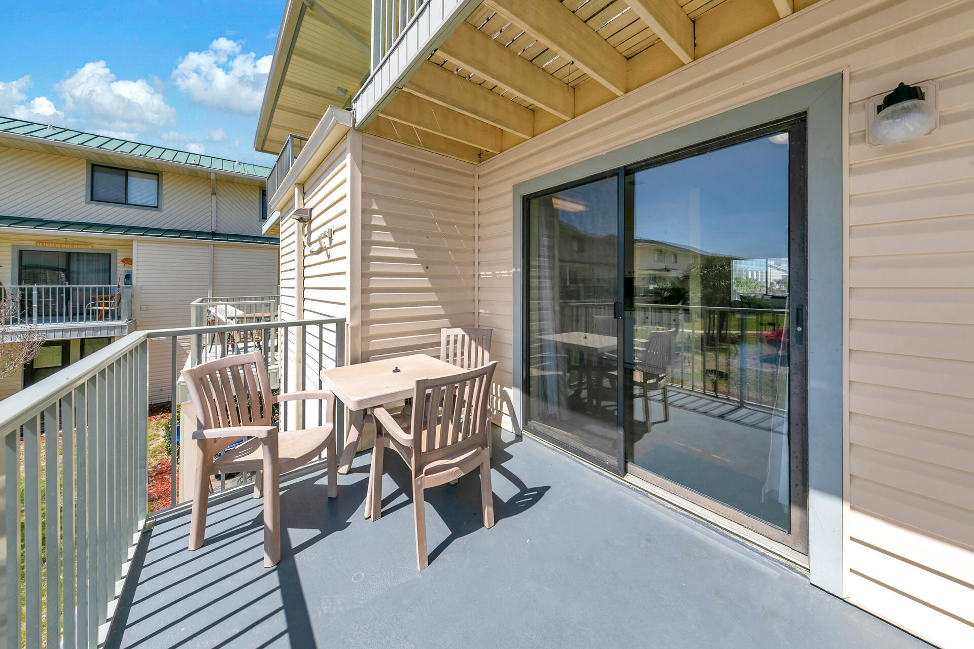60 Sandprints Drive, Unit C4 Miramar Beach, FL 32550 - Photo 17 of 28 a view of a chairs and table in the balcony