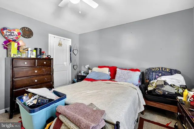 a bedroom with a bed and a dresser