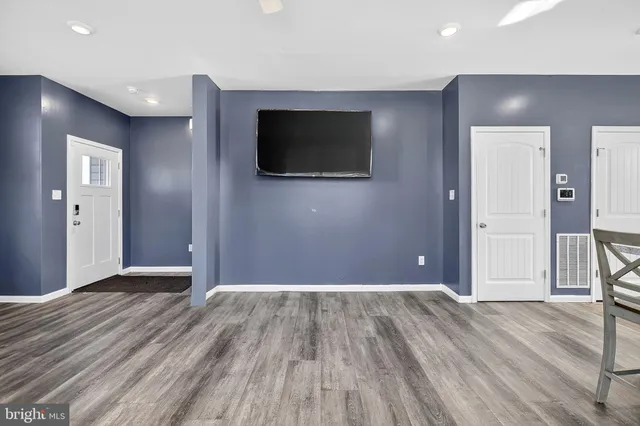 a view of a livingroom with wooden floor