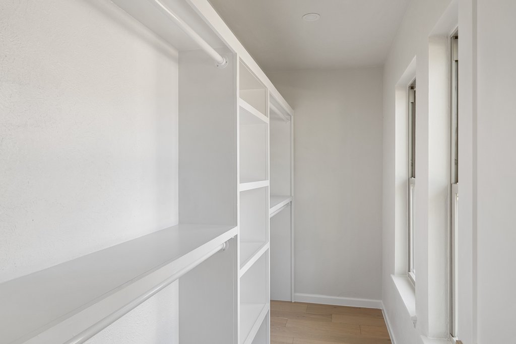 5213 Buffalo Pass Austin, TX 78745 - Photo 17 of 26 The primary retreat closet has functional storage and a walk-in closet.