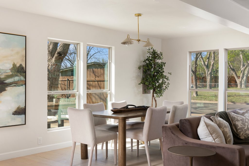 5213 Buffalo Pass Austin, TX 78745 - Photo 5 of 26 An open, seamless flow is found between living and dining spaces.