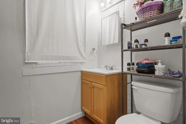 a bathroom with a sink and a washer dryer