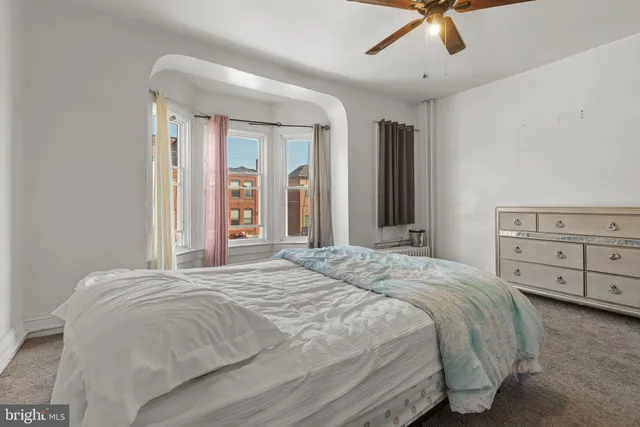 a bedroom with a bed and a closet