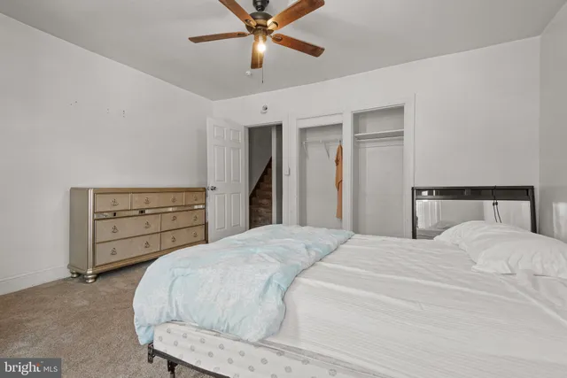 a bedroom with a bed and a closet