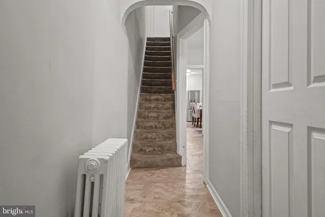 a view of a hallway with stairs