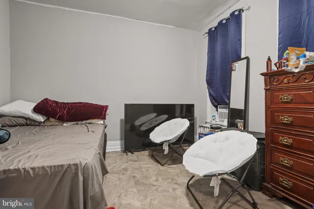 a bathroom with a sink mirror and toilet