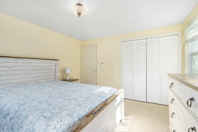 a view of a kitchen with a sink and cabinets