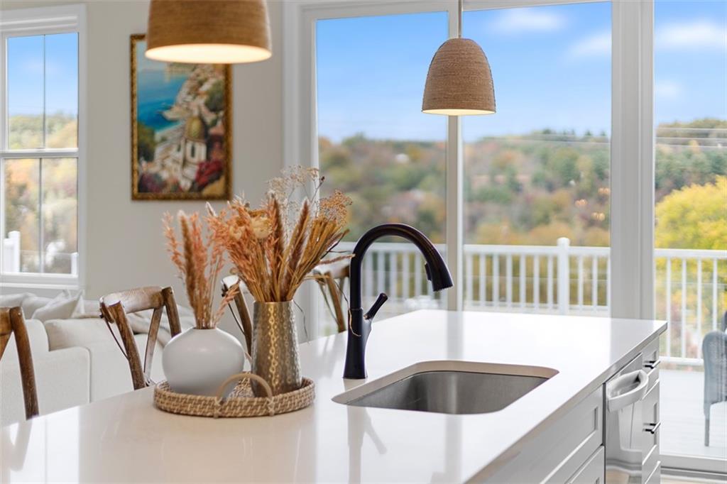 403 Walnut Court Pittsburgh, PA 15237 - Photo 17 of 42 a kitchen with a sink and a painting on the wall