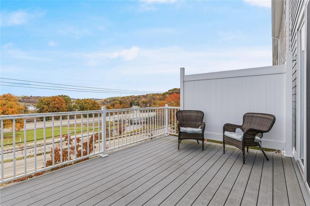 403 Walnut Court Pittsburgh, PA 15237 - Photo 20 of 42 a balcony with wooden floor table and chairs
