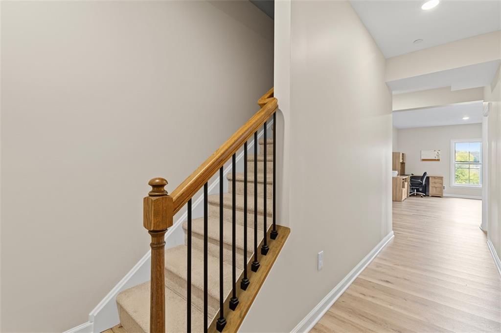 403 Walnut Court Pittsburgh, PA 15237 - Photo 22 of 42 a view of a hallway with wooden floor and staircase