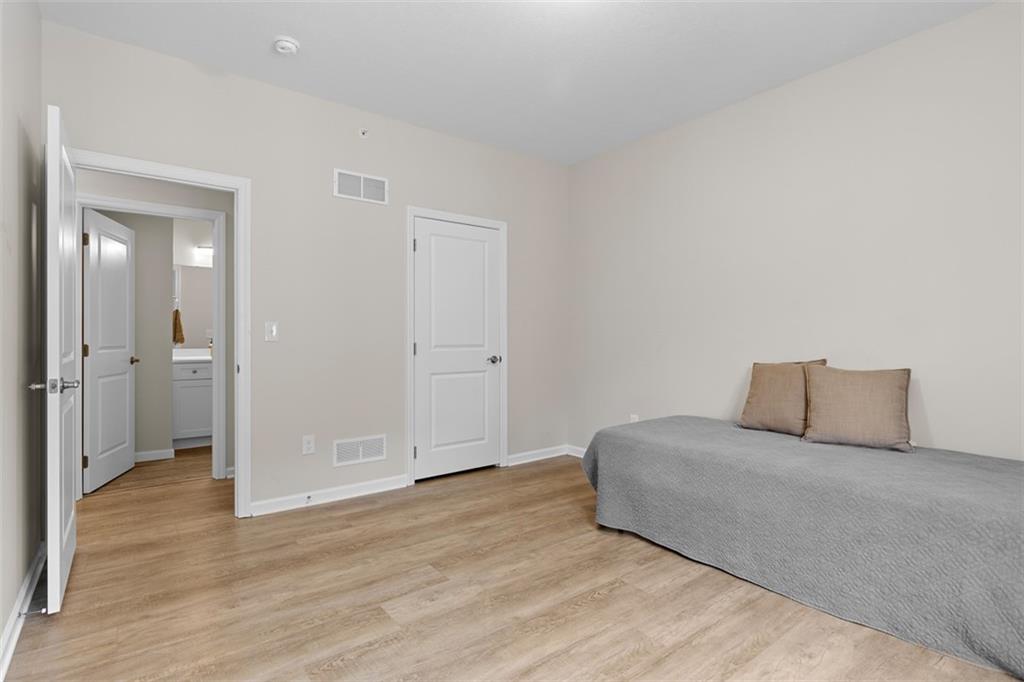 403 Walnut Court Pittsburgh, PA 15237 - Photo 38 of 42 a room with a bed and wooden floor