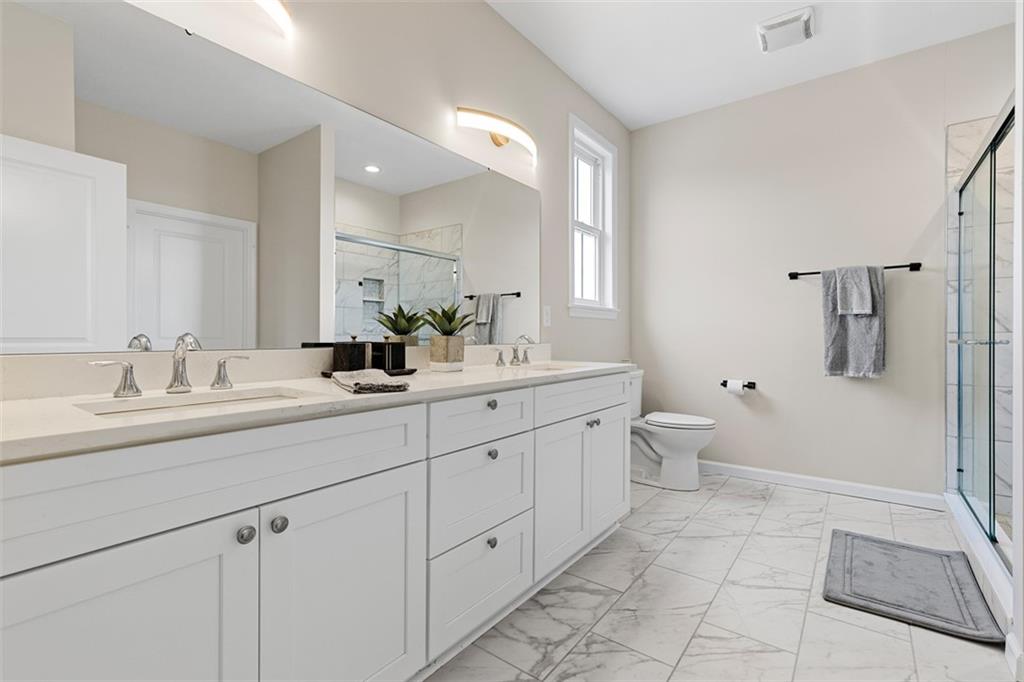 403 Walnut Court Pittsburgh, PA 15237 - Photo 6 of 42 a bathroom with a double vanity sink mirror and toilet