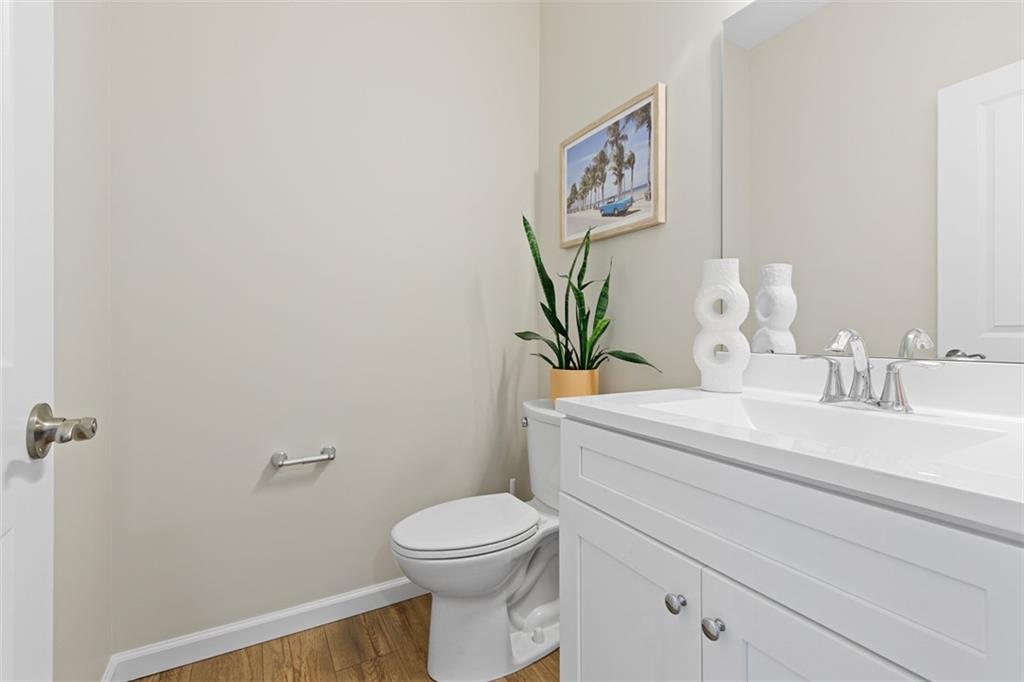 403 Walnut Court Pittsburgh, PA 15237 - Photo 8 of 42 a bathroom with a toilet sink and mirror