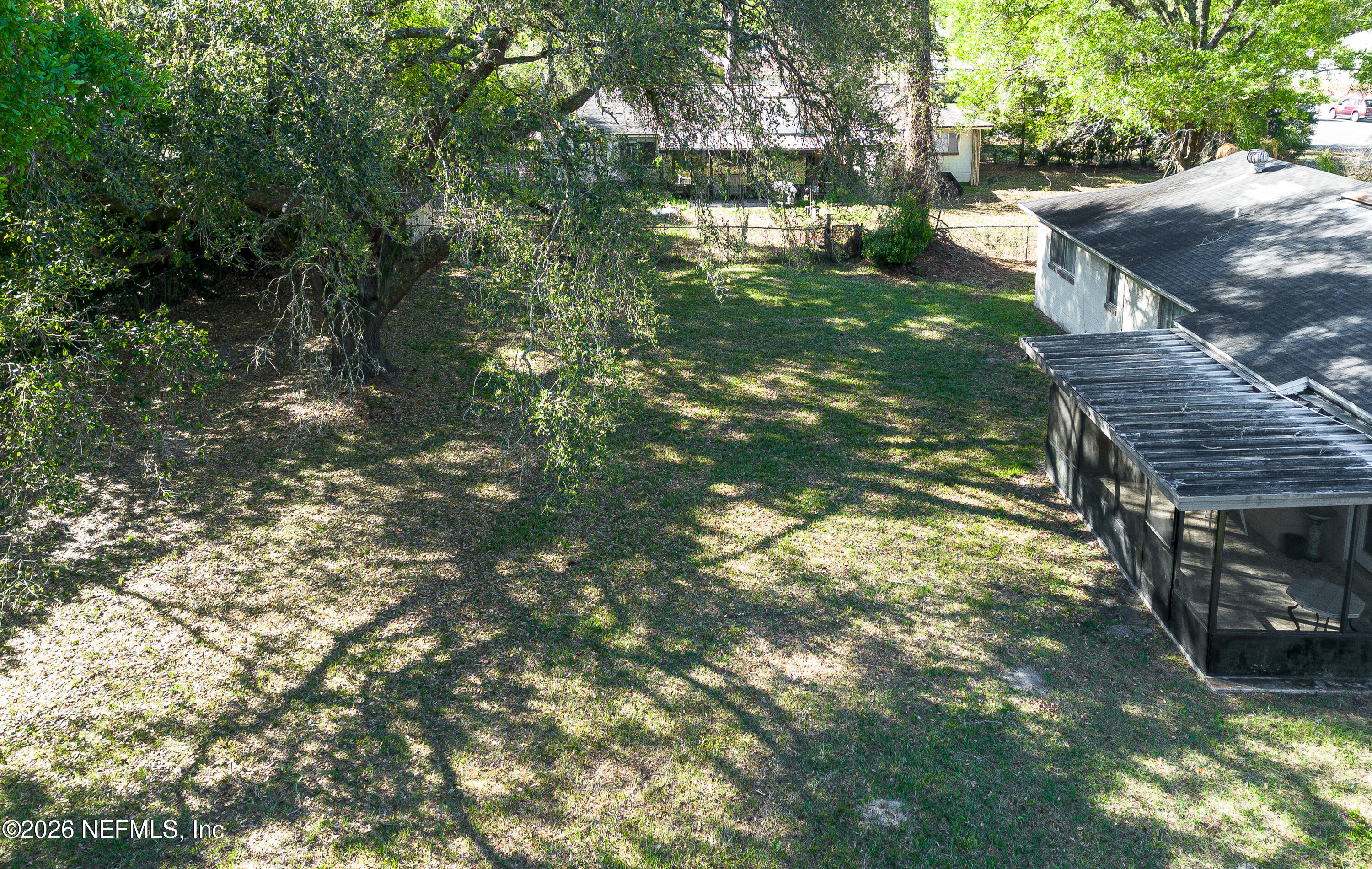 147 Knight Boxx Road Middleburg, FL 32068 - Photo 22 of 30 a backyard of a house with lots of green space