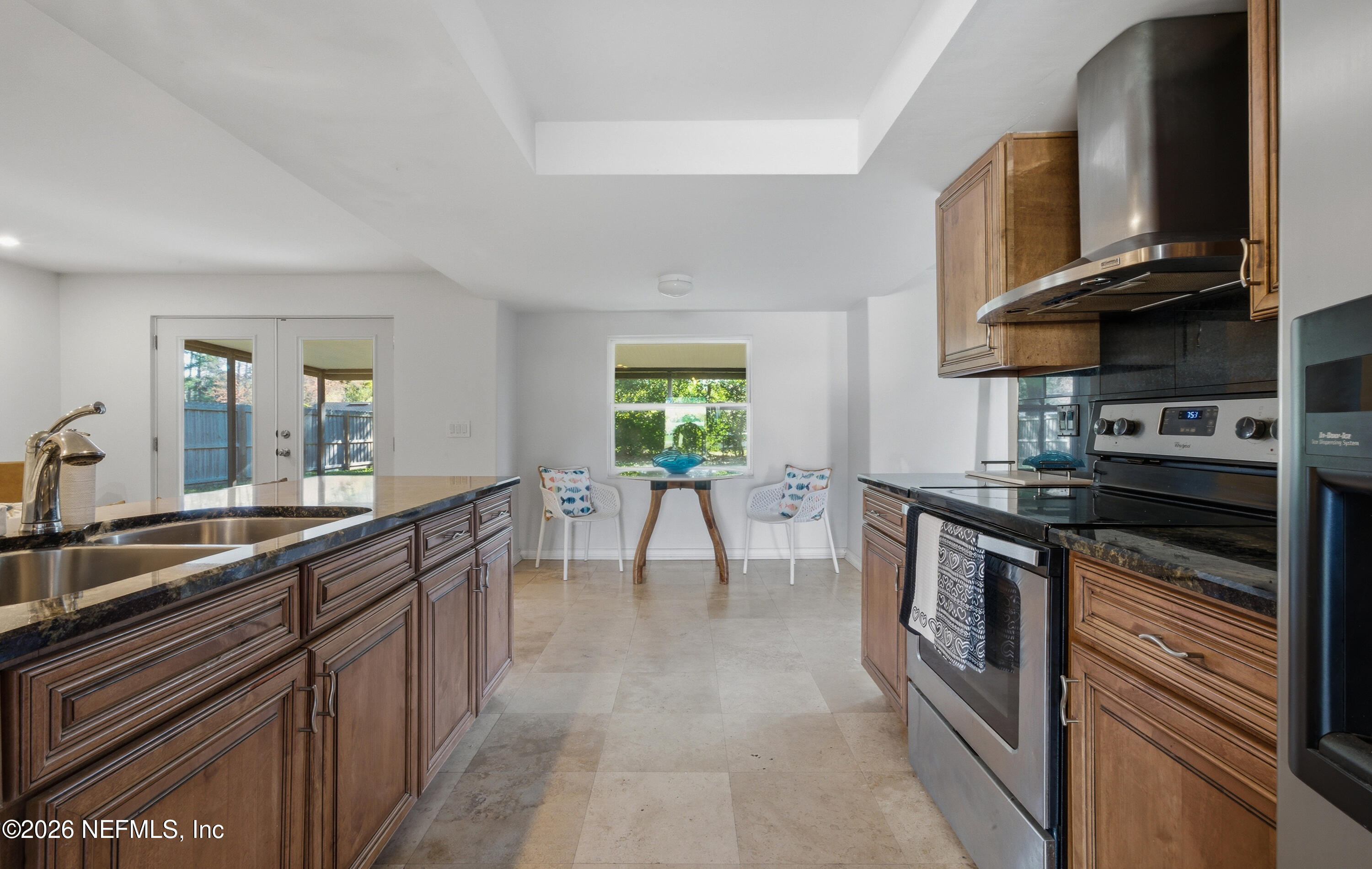 147 Knight Boxx Road Middleburg, FL 32068 - Photo 5 of 30 a kitchen with stainless steel appliances granite countertop a stove a sink and a microwave