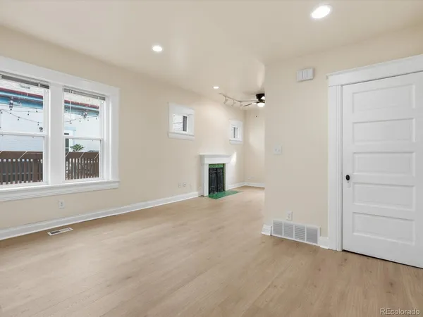 wooden floor in an empty room with a window
