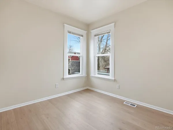 an empty room with windows