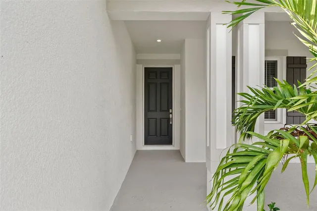 a view of a potted plants in front of house
