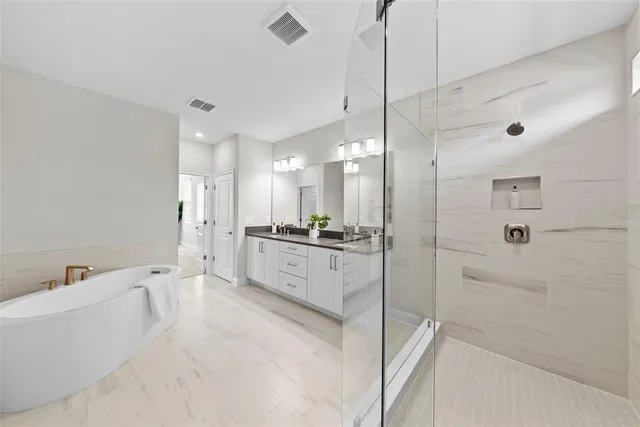a white bath tub sitting in a bathroom