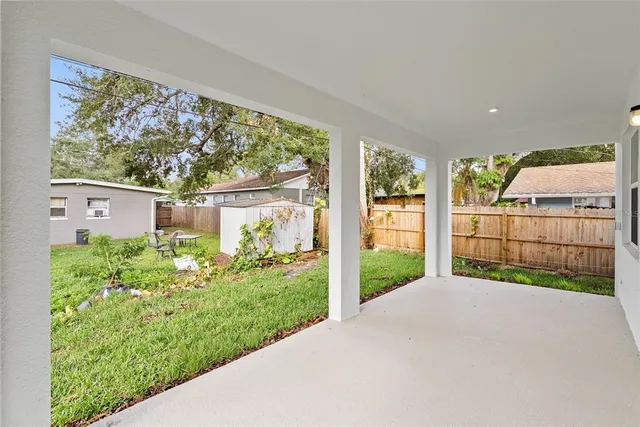 a view of a backyard with potted plants